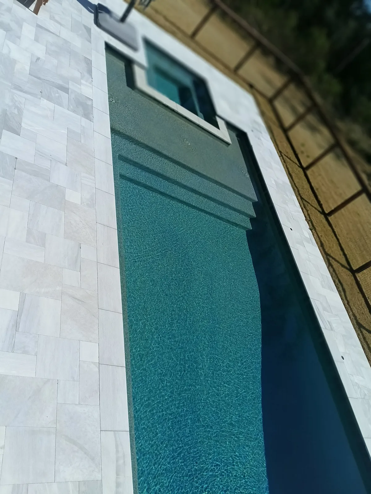 Clean pool with waterfall feature
